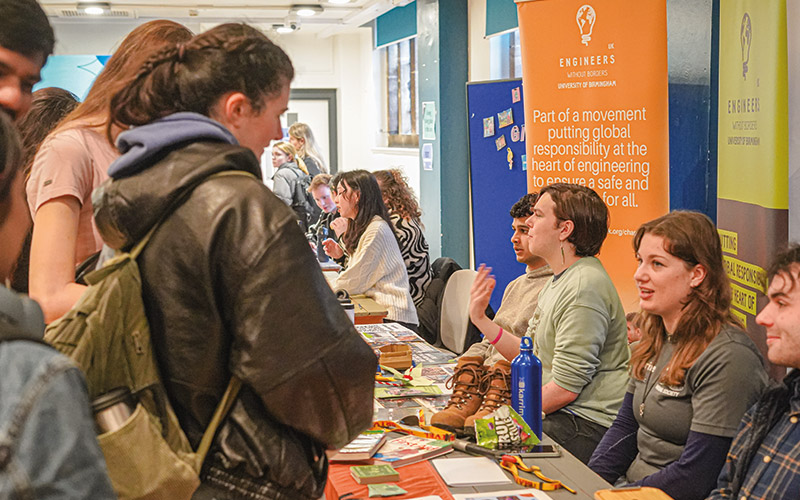 an image of studnets at a promotional table at welcome